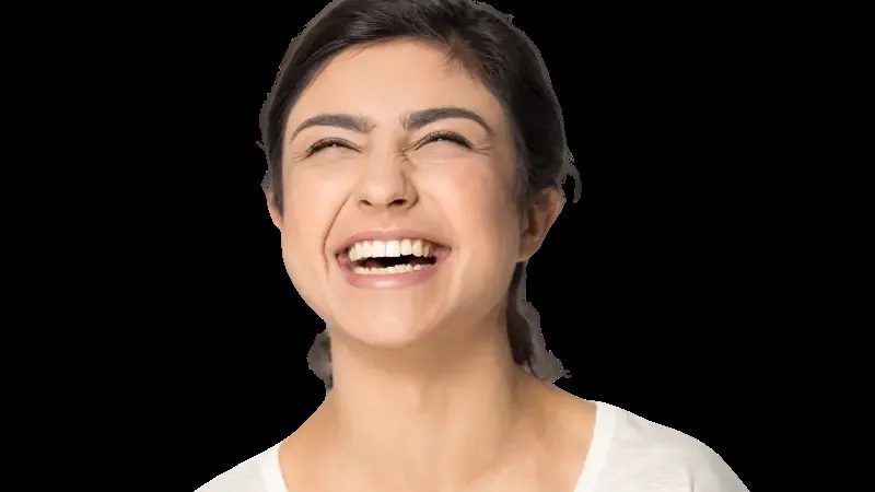 Woman laughing with an even smile after dental bonding for chipped teeth and gaps